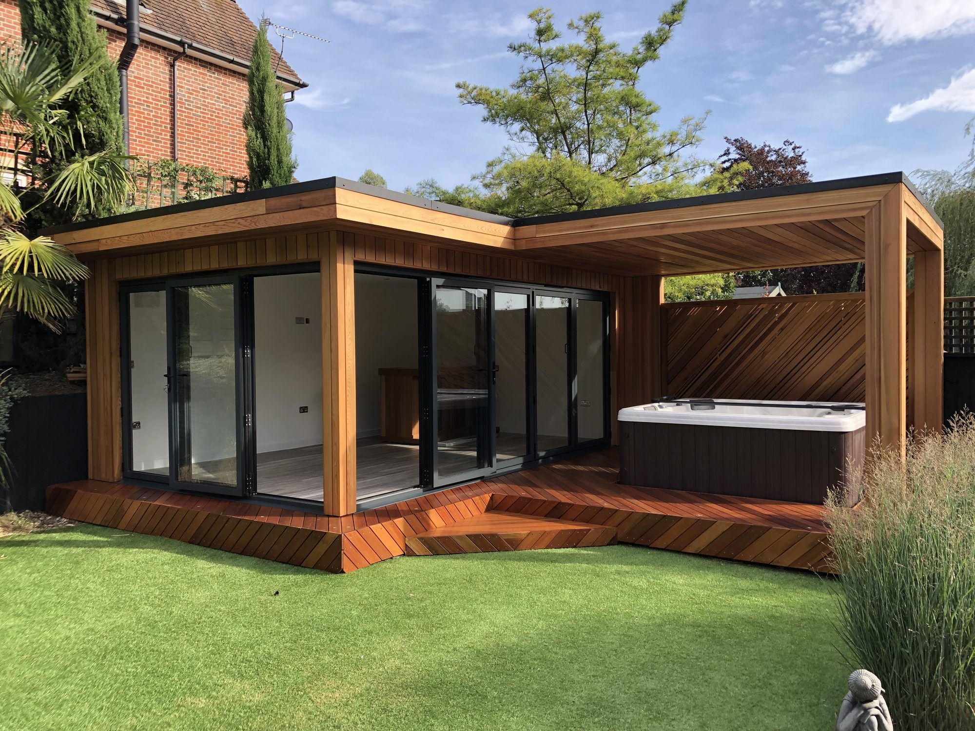 Cedar-clad garden room with wraparound deck and hot tub